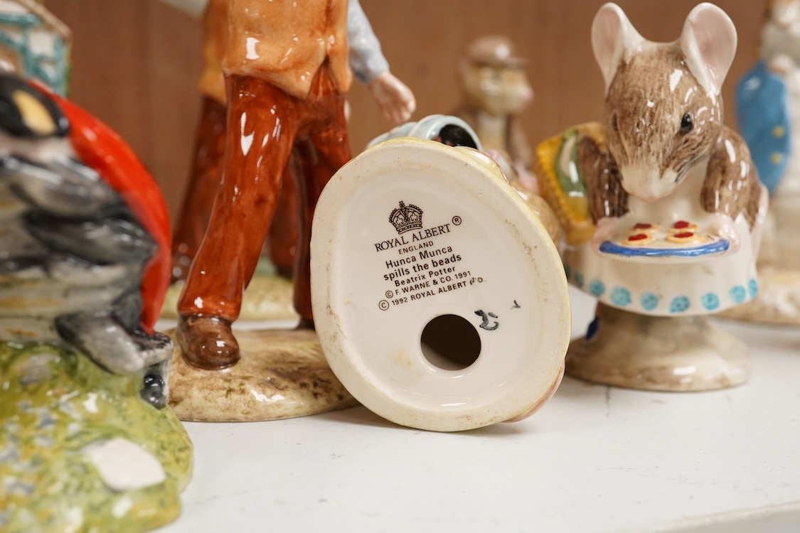 A collection of eighteen mixed Royal Doulton and Royal Albert figures of Beatrix Potter characters, largest 13cm high